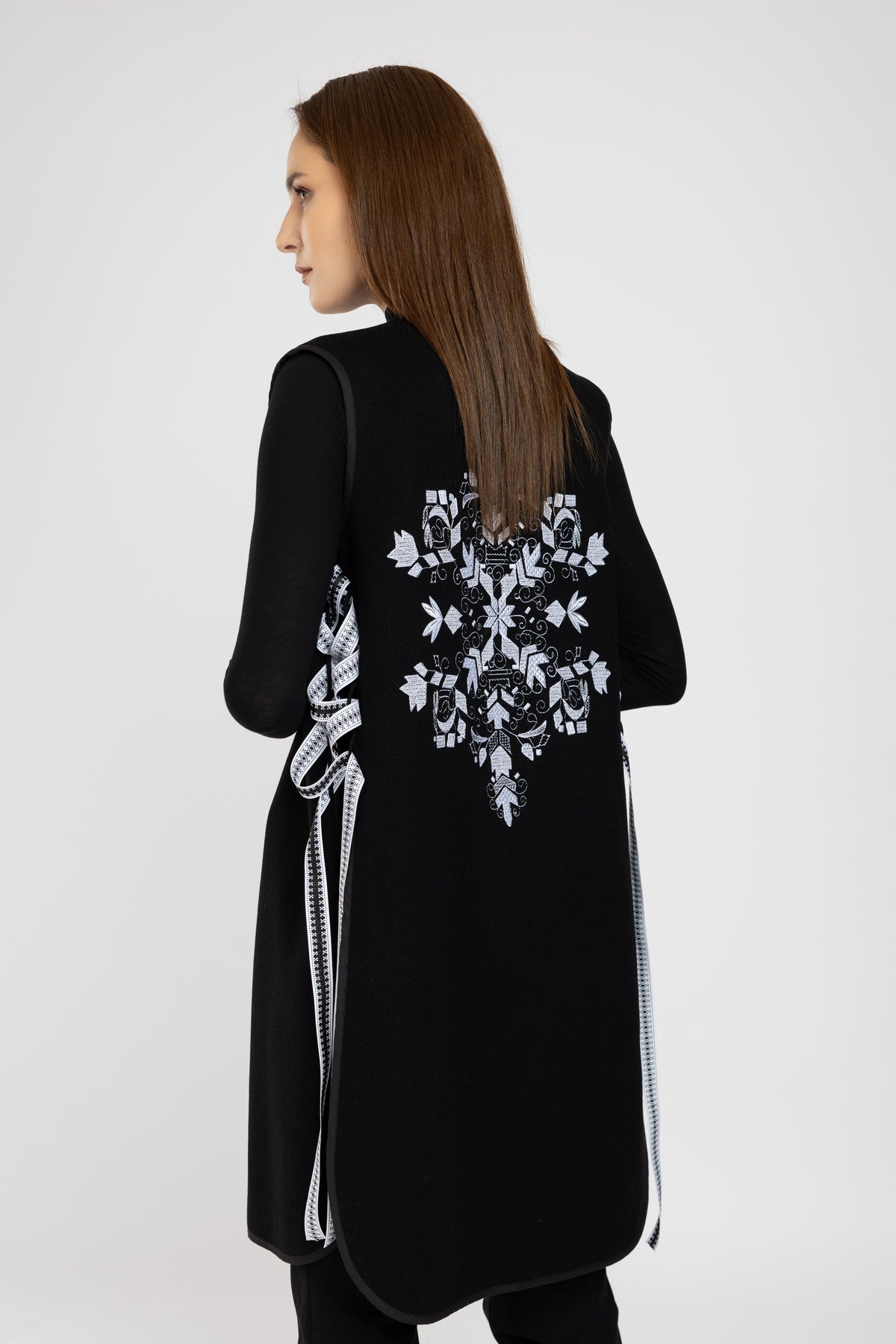 Black woolen midi vest with white floral embroidery and stripes on the side