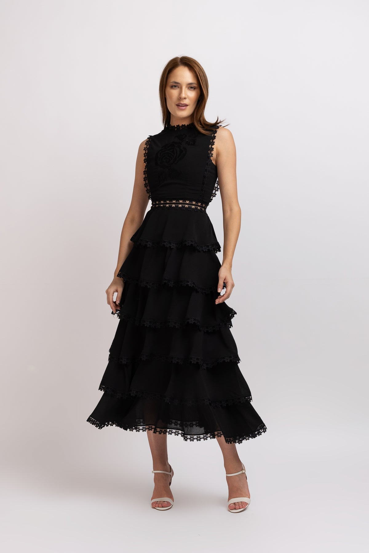 Black dress in vascose with ruffles and floral lace
