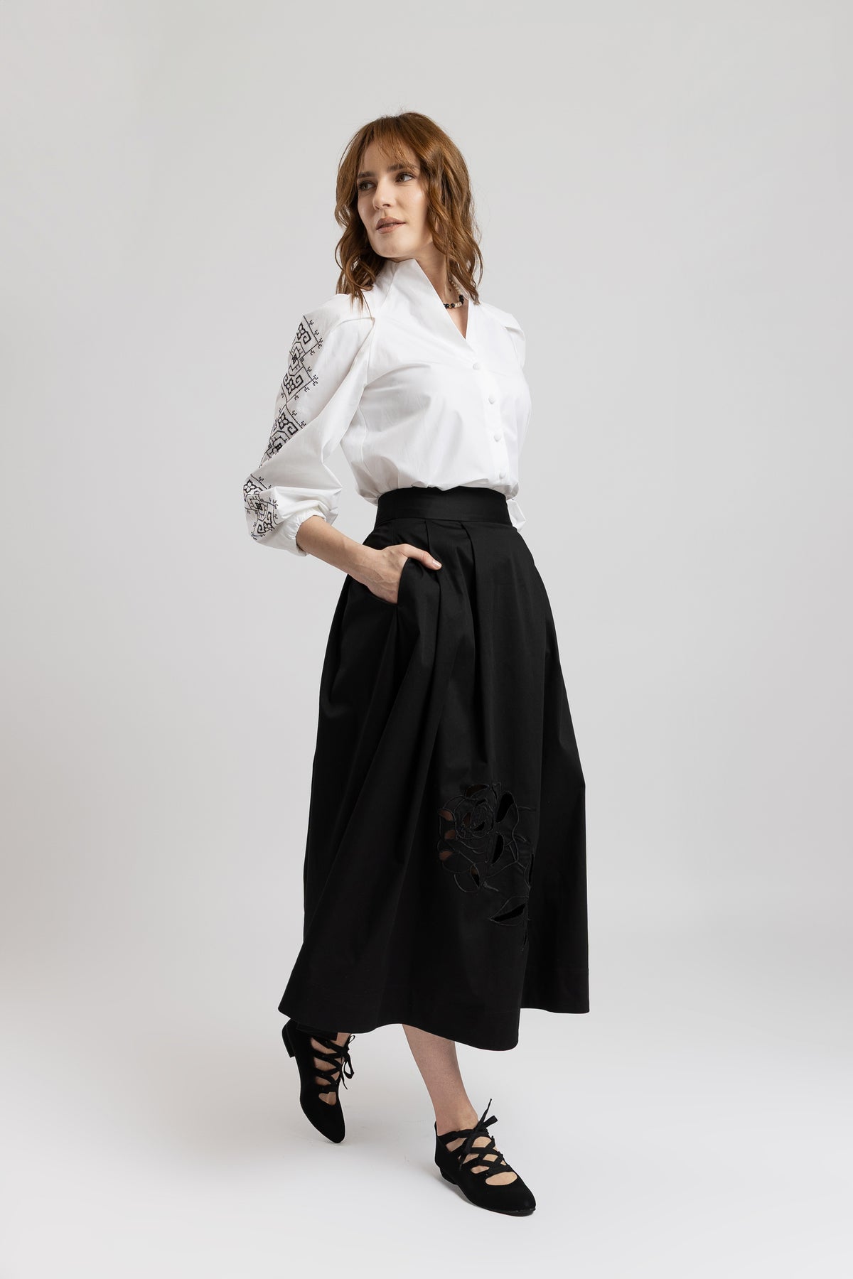 Black cotton midi skirt with embroidered rose