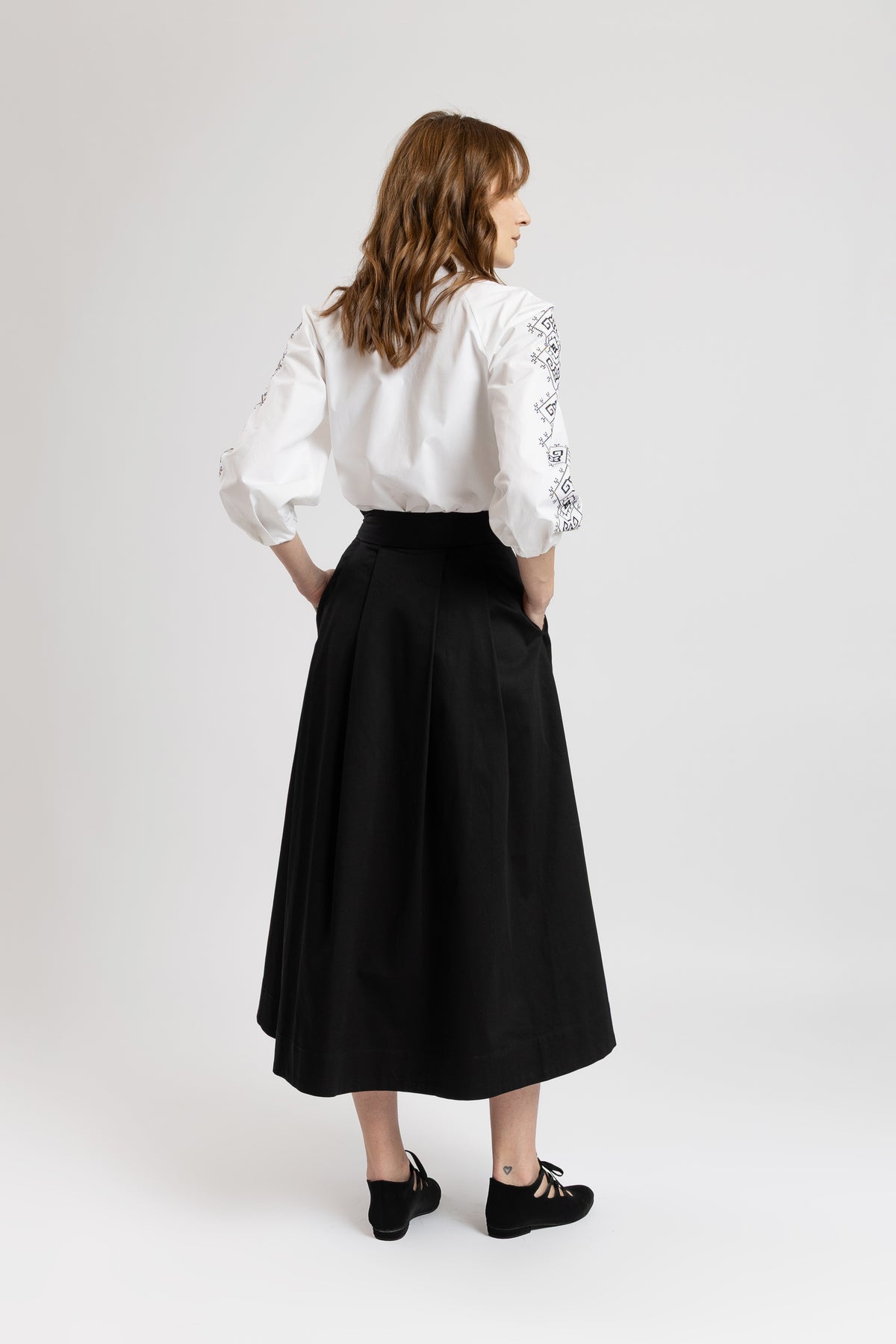 Black cotton midi skirt with embroidered rose