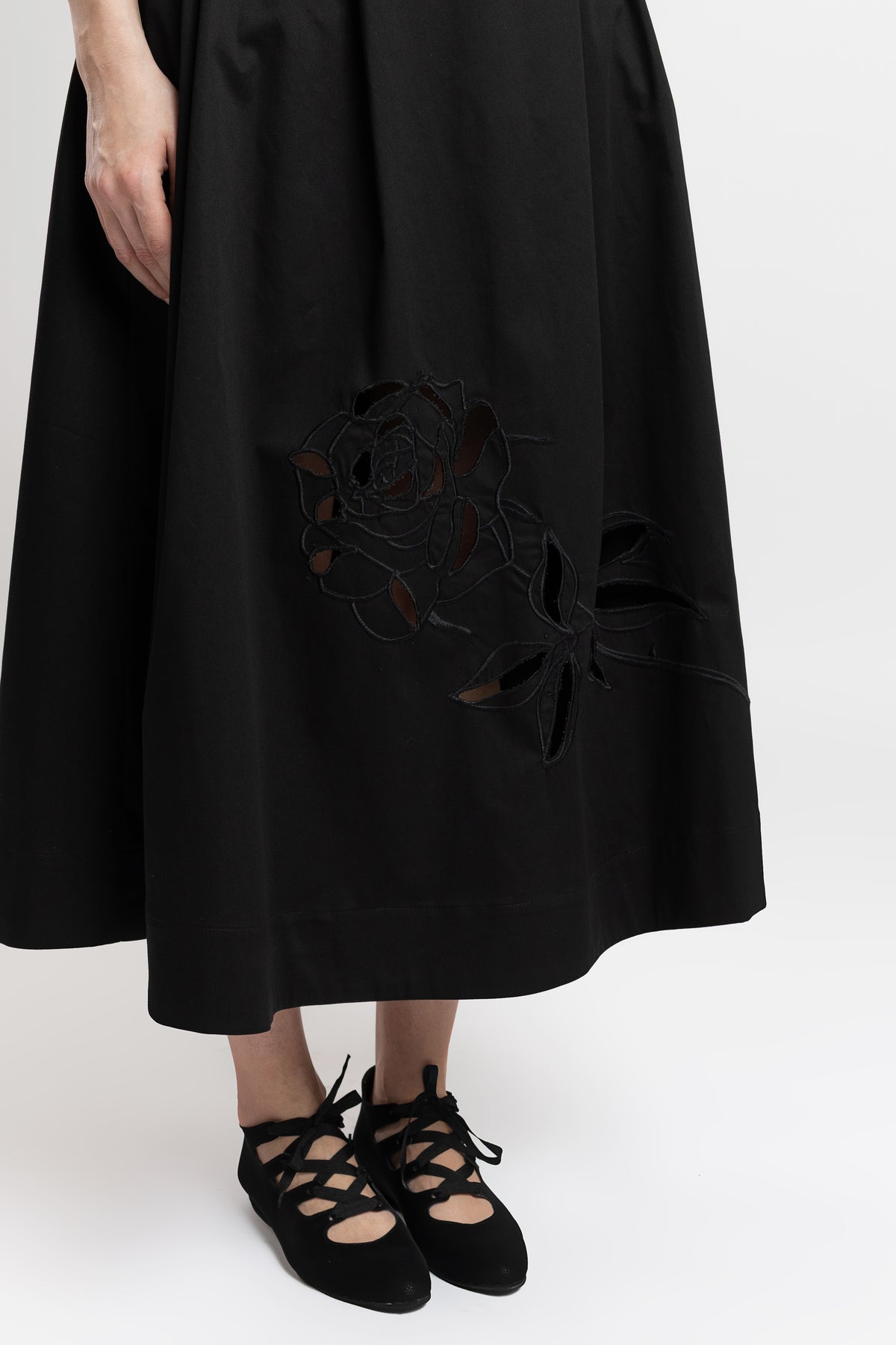 Black cotton midi skirt with embroidered rose