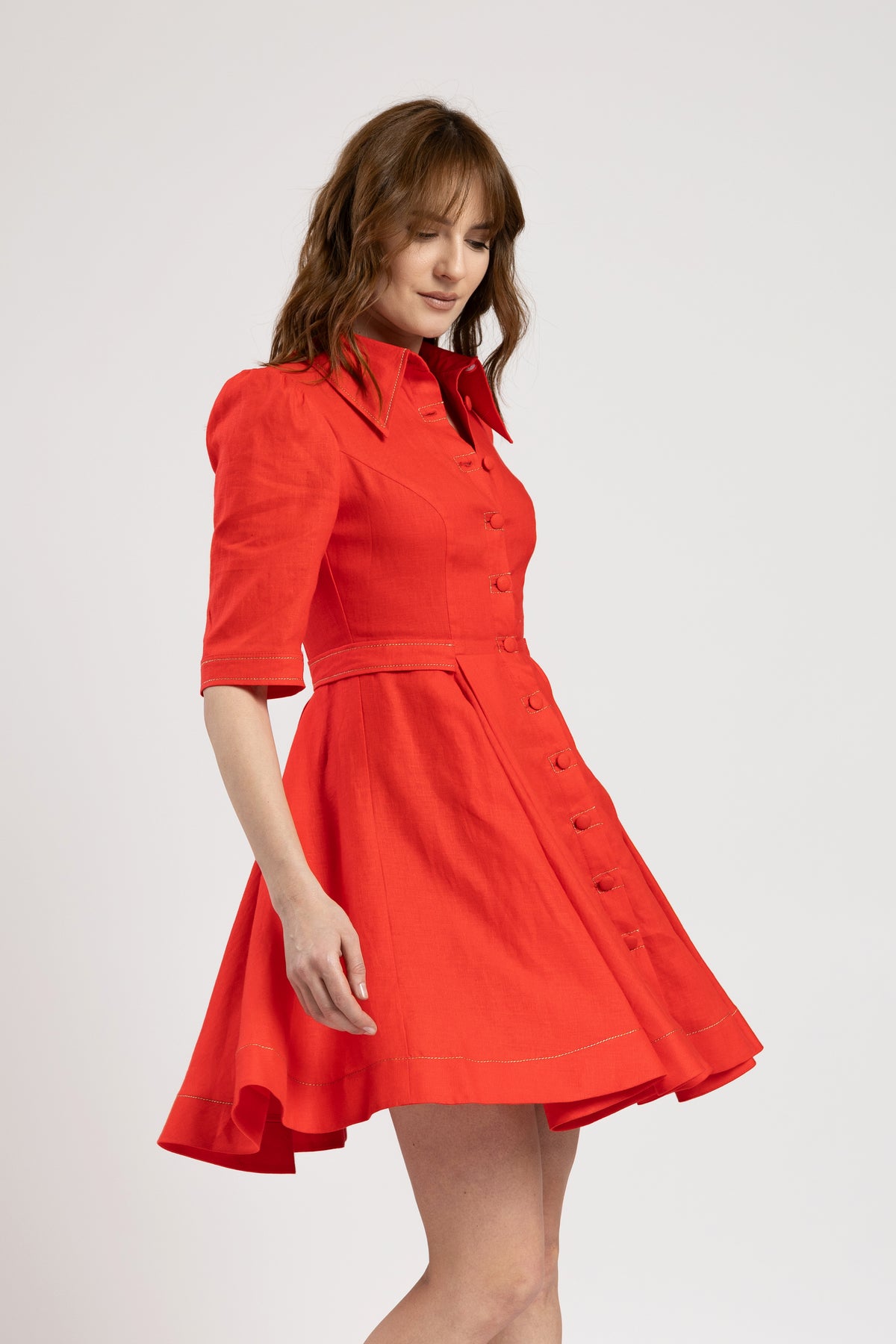 Short dress in vibrant red linen with metallic stitching