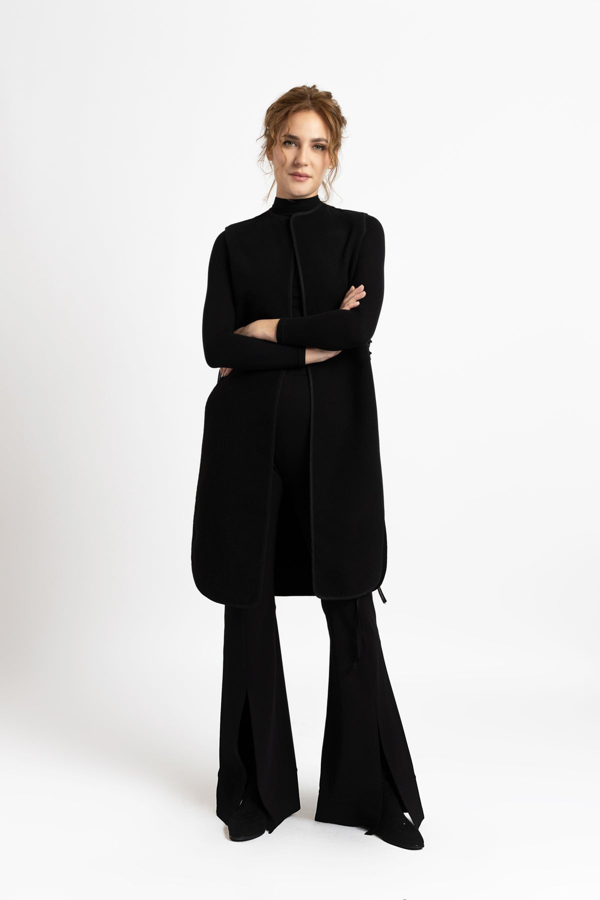 Black woolen midi vest with drawstrings on the sides