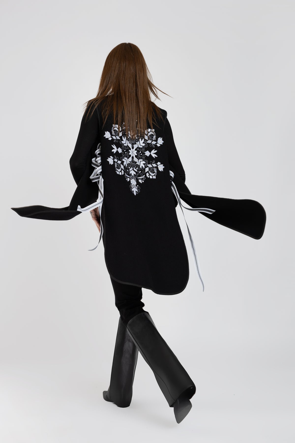 Black woolen midi vest with white floral embroidery and stripes on the side