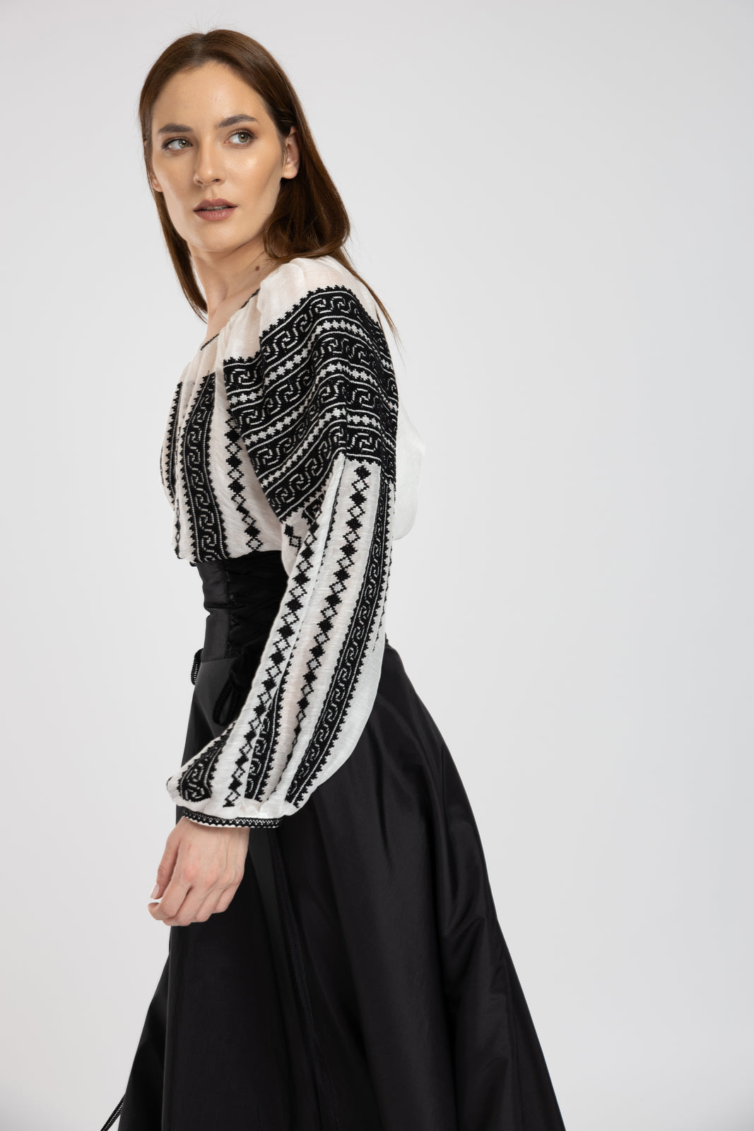 Load image into Gallery viewer, The blouse is hand-stitched with black thread on silk marquisette