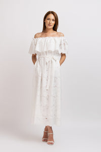 White cotton midi dress with floral embroidery and cropped shoulders