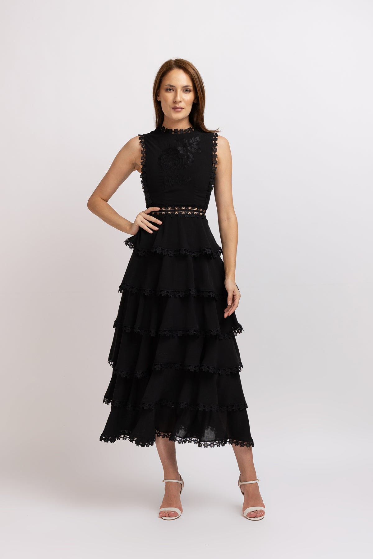 Black dress in vascose with ruffles and floral lace
