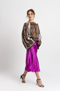 Hand-sewn ie blouse with beads and rich geometric embroidery in earthy and violet tones
