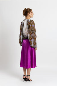 Hand-sewn ie blouse with beads and rich geometric embroidery in earthy and violet tones
