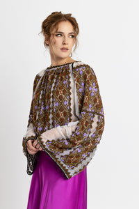 Hand-sewn ie blouse with beads and rich geometric embroidery in earthy and violet tones
