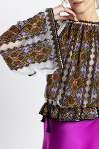 Hand-sewn ie blouse with beads and rich geometric embroidery in earthy and violet tones
