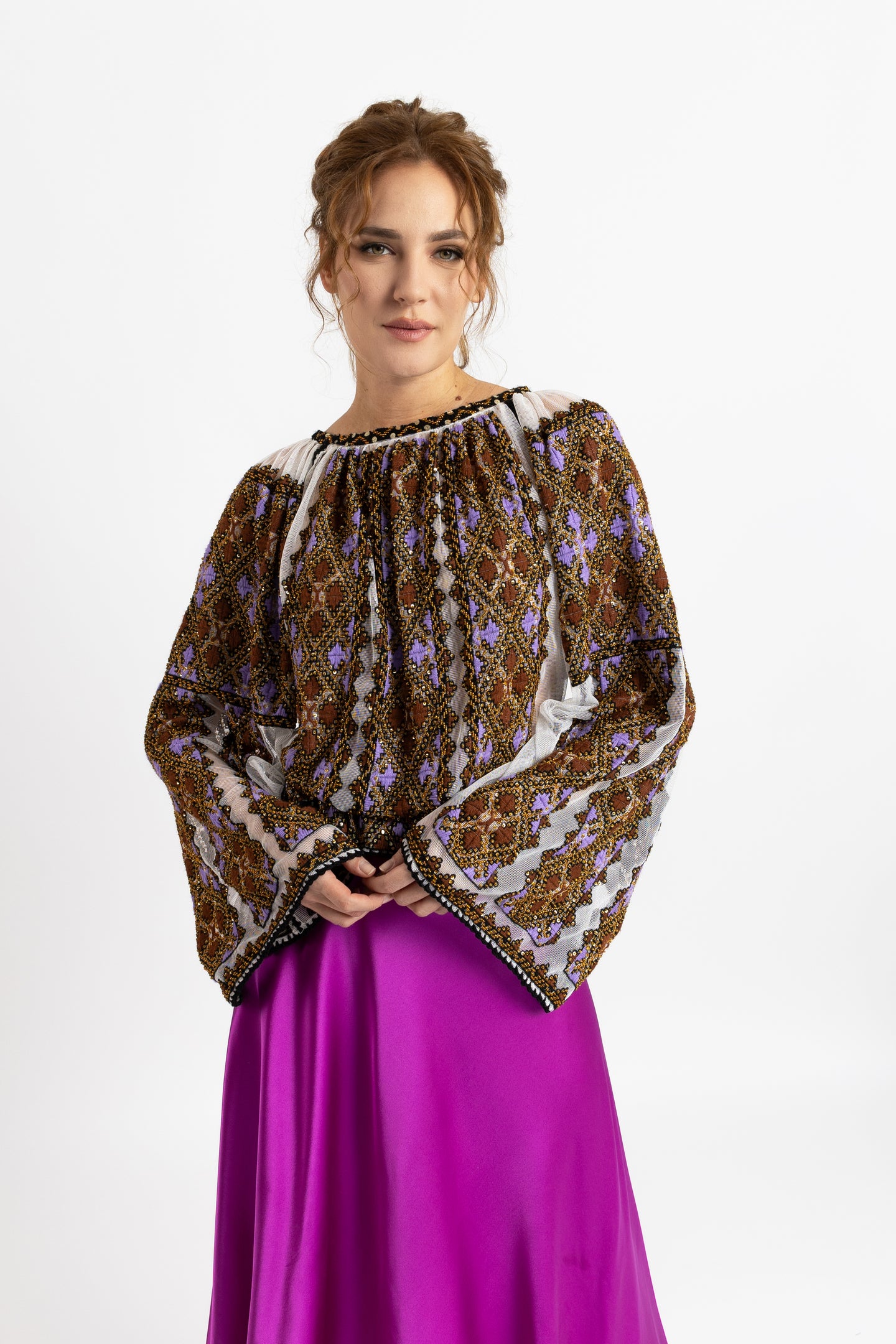 Hand-sewn ie blouse with beads and rich geometric embroidery in earthy and violet tones
