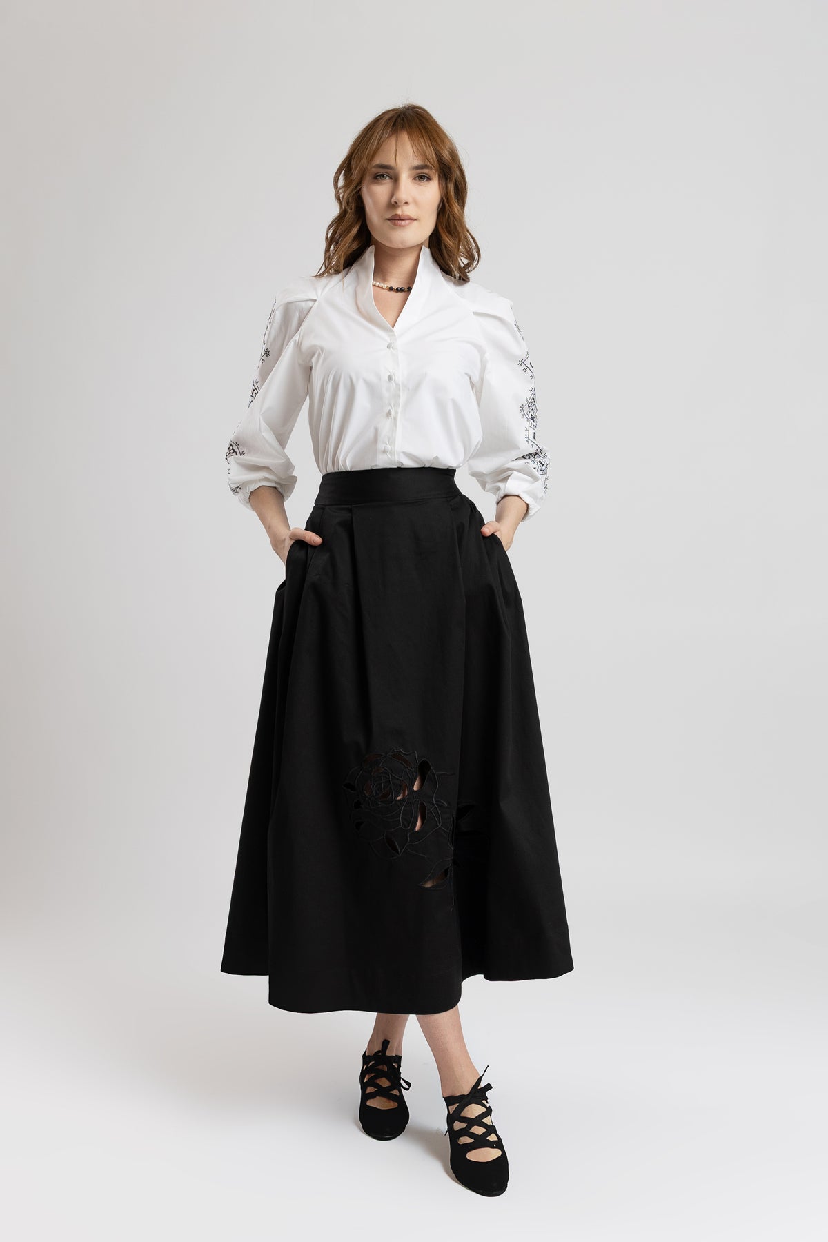 Black cotton midi skirt with embroidered rose
