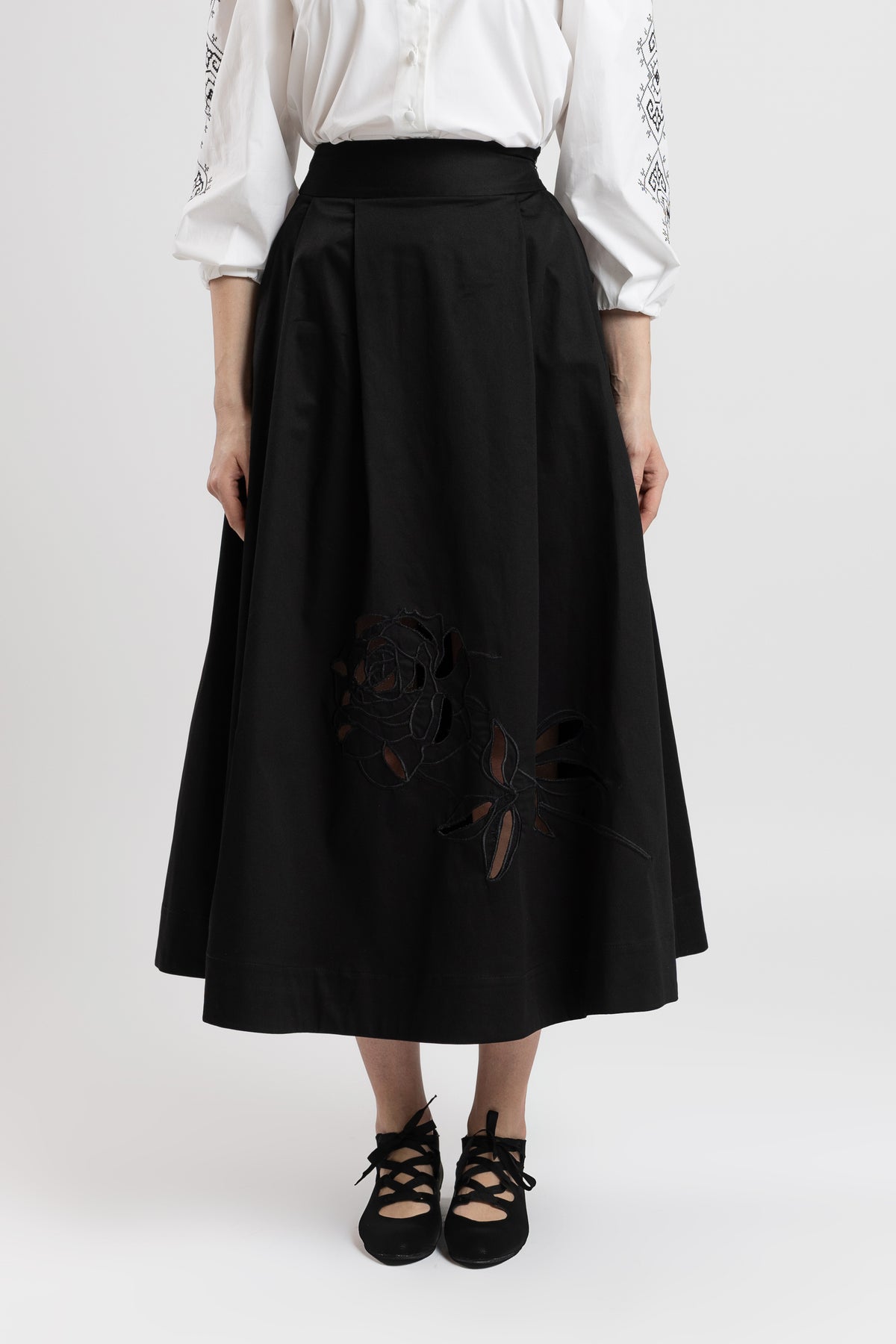 Black cotton midi skirt with embroidered rose