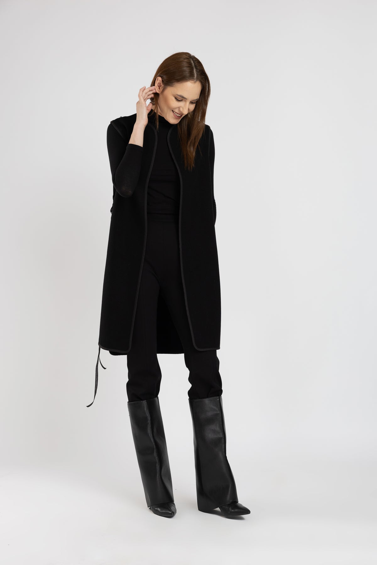 Black woolen midi vest with multicolored floral embroidery and stripes on the side