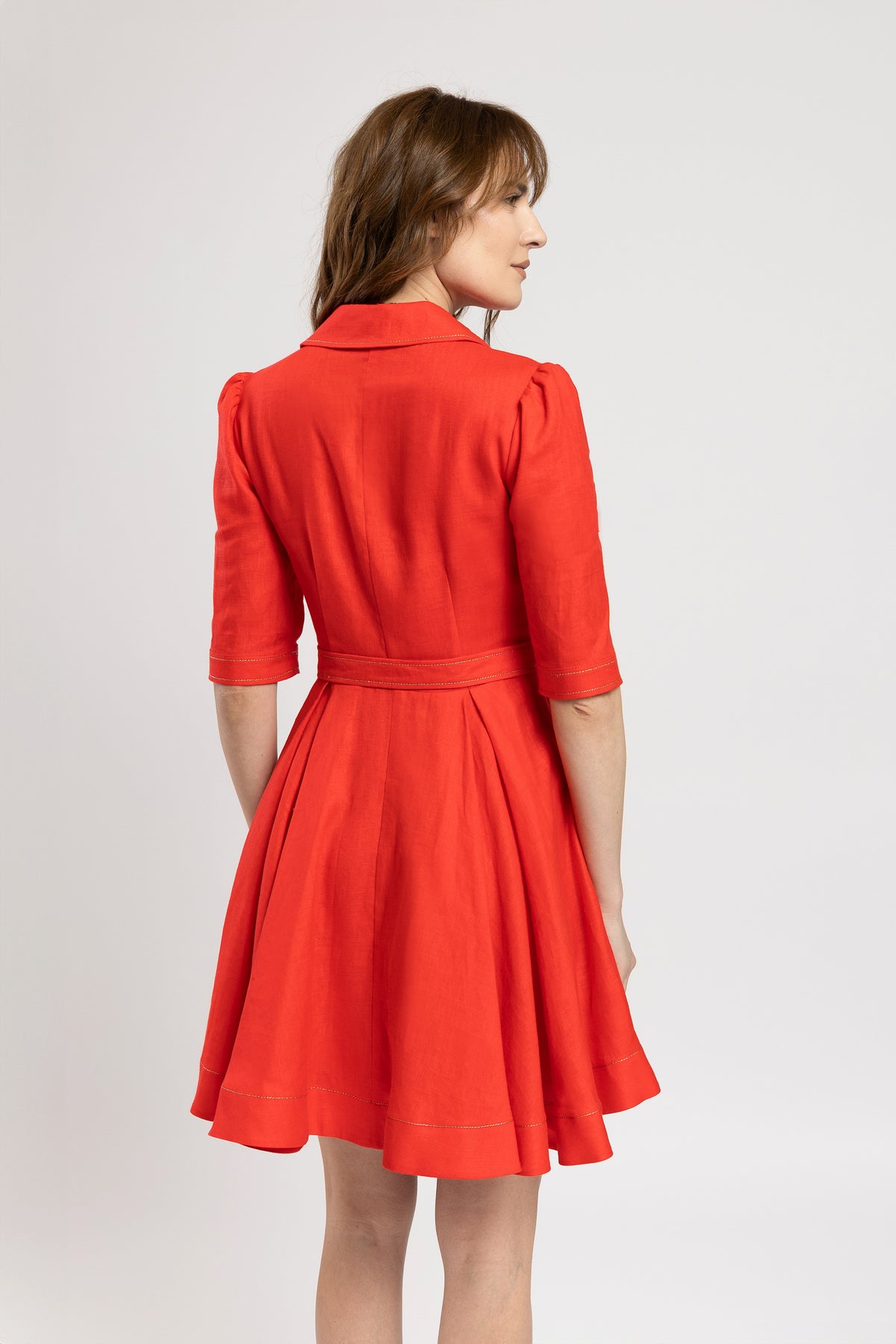 Short dress in vibrant red linen with metallic stitching