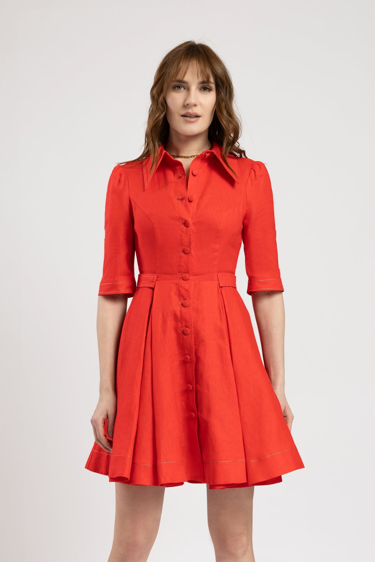 Short dress in vibrant red linen with metallic stitching