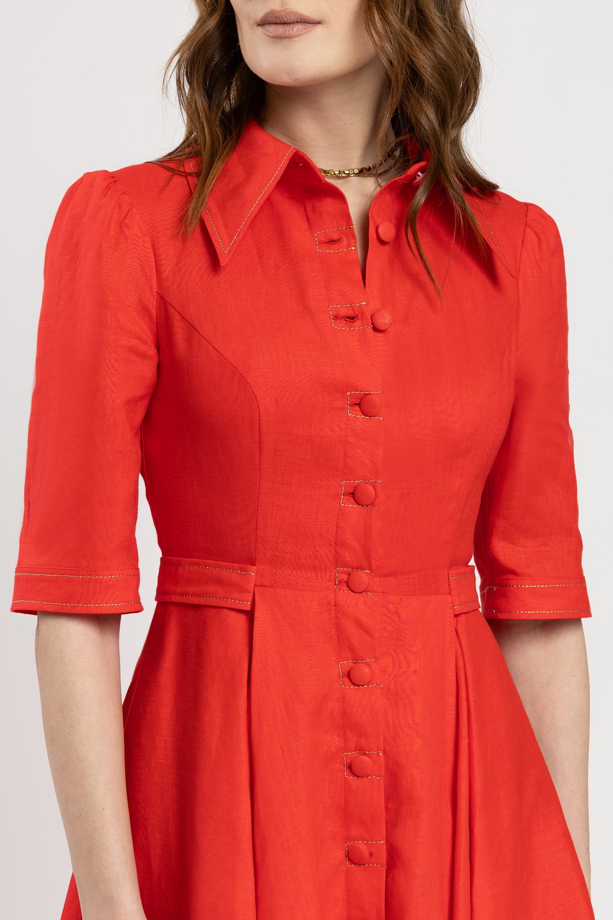 Short dress in vibrant red linen with metallic stitching
