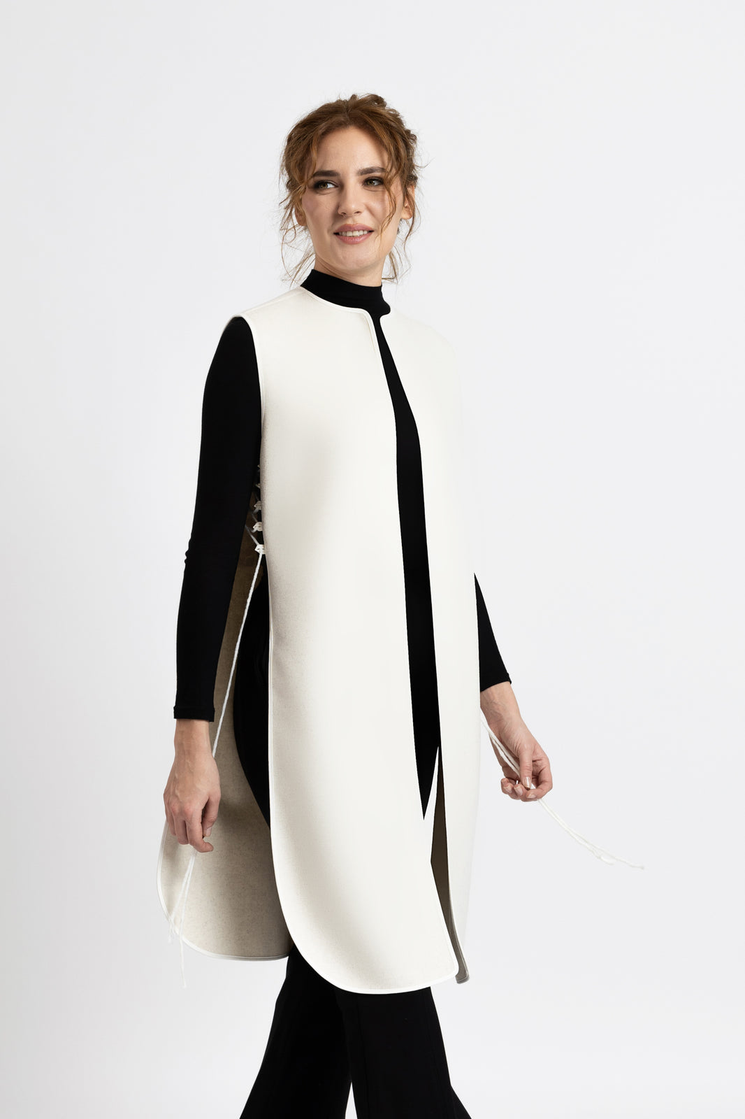 Load image into Gallery viewer, Black woolen midi vest with white floral embroidery and stripes on the side