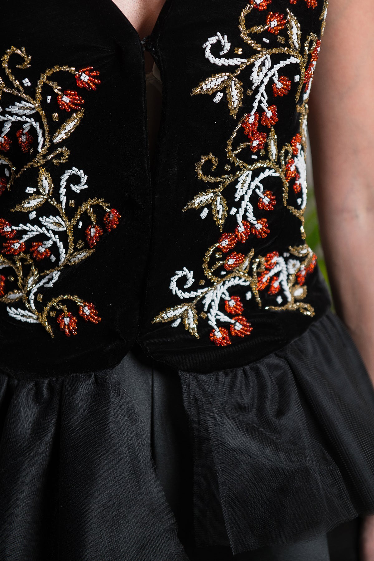 Vest with hand-stitched beads and asymmetrical tulle layers